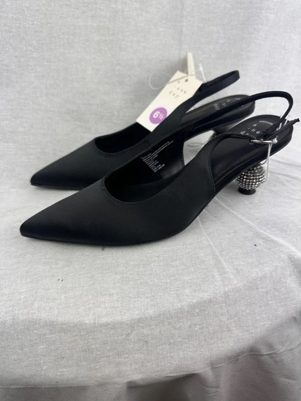 Black Pointed Slingback Pumps with Embellished Heel